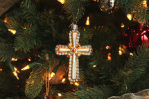 cross ornament on a Christmas tree 