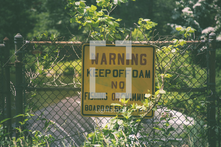 warning sign, warning keep off dam, No fishing or swimming on a gate 
