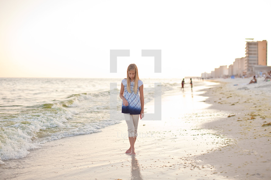 girl walking on a beach
