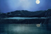 full moon over a shore in Alaska 