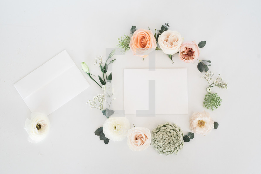 wreath around invitations for a wedding 