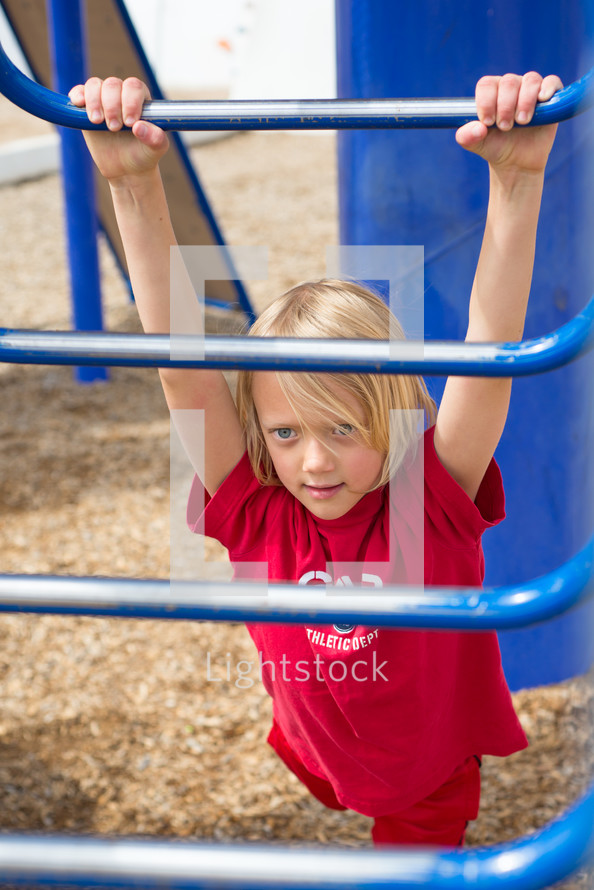 a child playing on a playground 