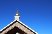 a church steeple against a cobalt blue sky 