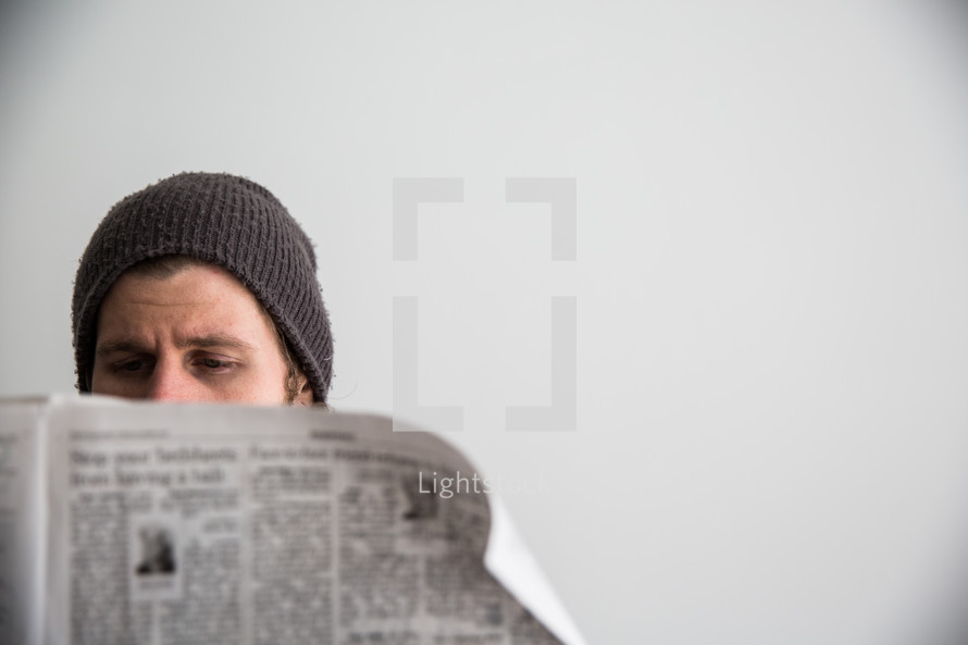 man reading a newspaper 