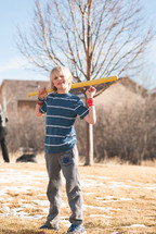 boy child with a plastic baseball bat 