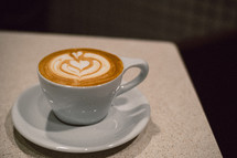 heart shape creamer design in coffee cup 