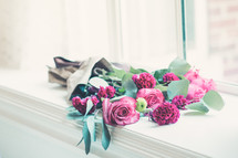bouquet of roses in a window sill 