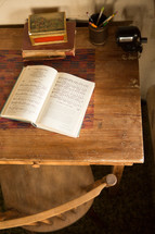 hymnal open on a desk 