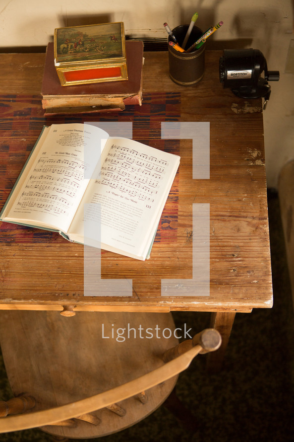 hymnal open on a desk 