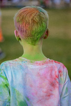 a colorful boy after a color run 