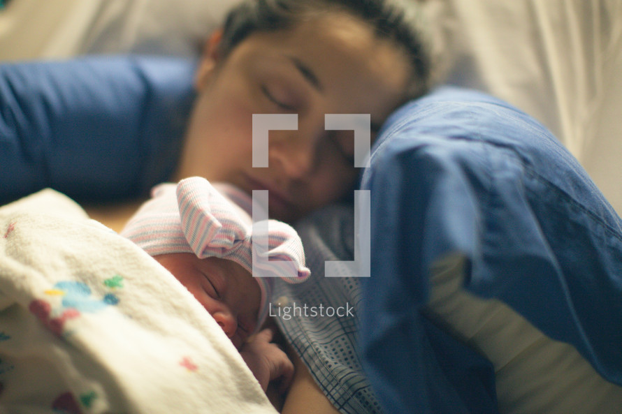 a new mother holding a newborn baby 