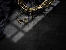 crown of thorns and nails on a black background 