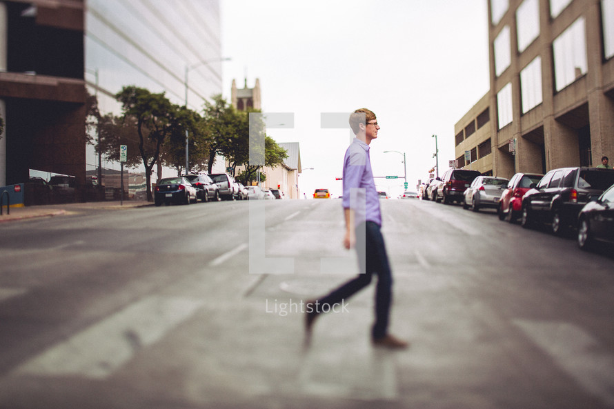 man crossing a street