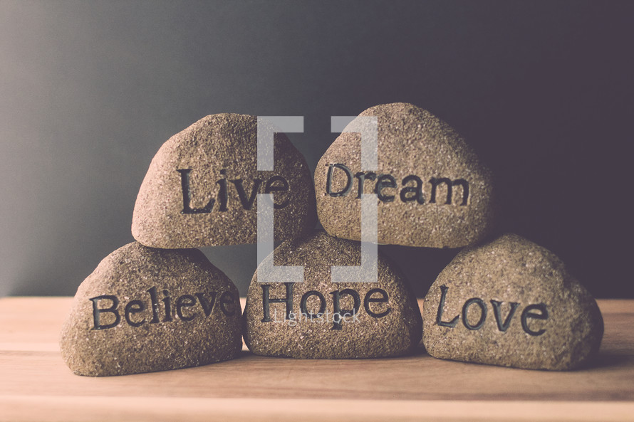 stones with the words live, love, dream, hope, and believe 