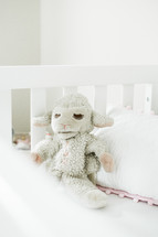 stuffed animal in a crib 