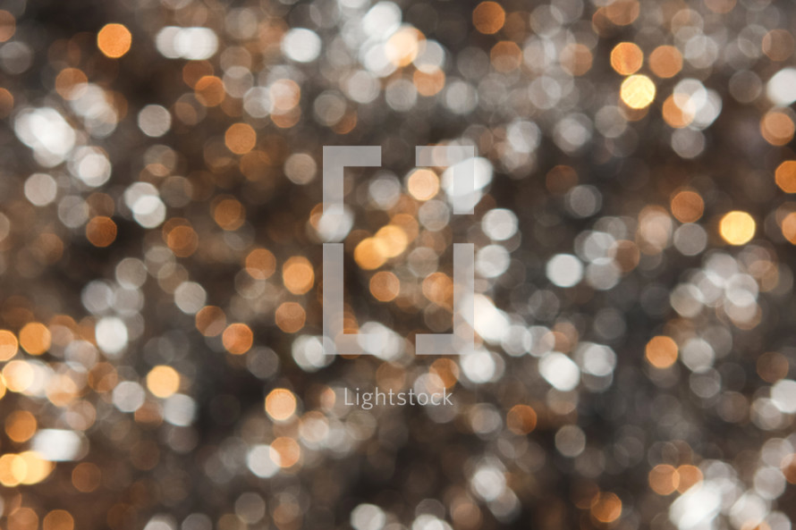 Silver and gold bokeh lights background 
