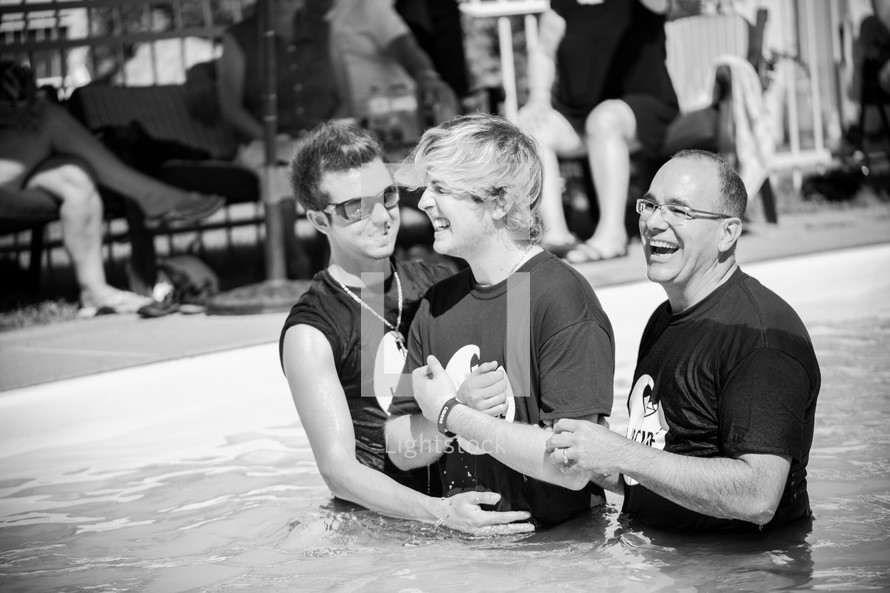 a teen boy being baptized 