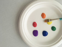 paint and paint brush on a plate 