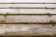snow on a wood deck 