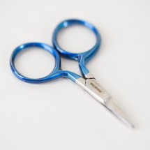 blue handled scissors on white background 