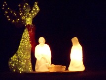 Nativity Christmas light display at night 