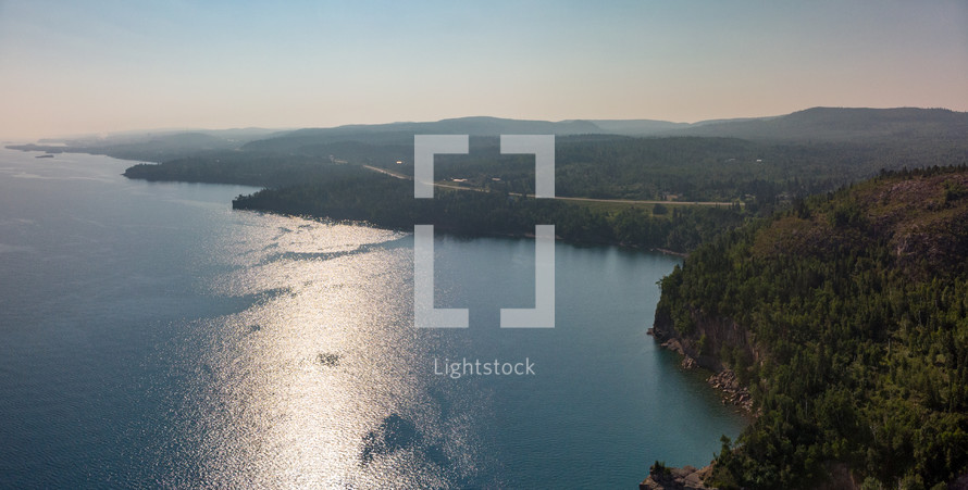 aerial view over sunlight reflecting off of water 