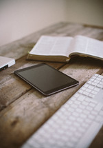 Using tablet together with bible and writing at the computer 