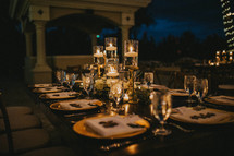 set table on a patio at night 