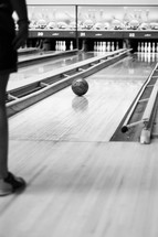 bowling bowl rolling down to make a strike 
