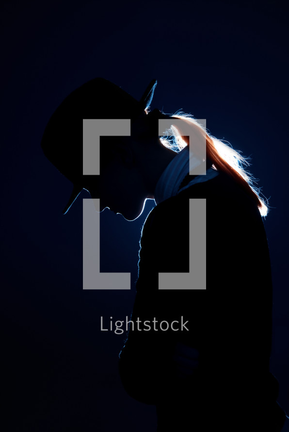 Sad Woman In Hat On A Dark Background With Photo Lightstock