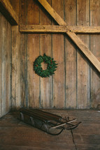 wood sled and wreath 