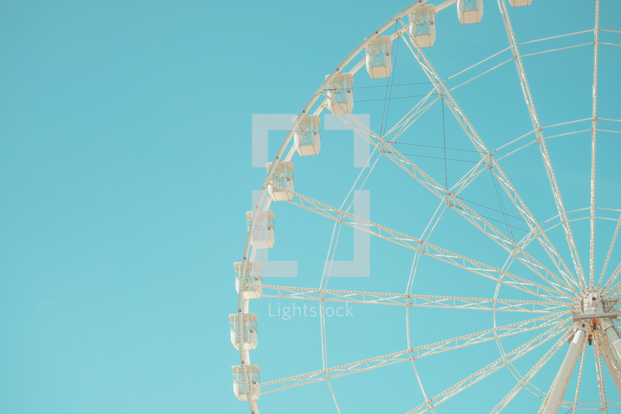 Ferris Wheel against blue sky
