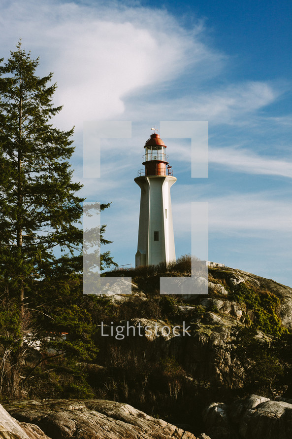 lighthouse above rocks