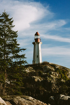 lighthouse above rocks