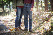 legs of a husband and wife in fall 
