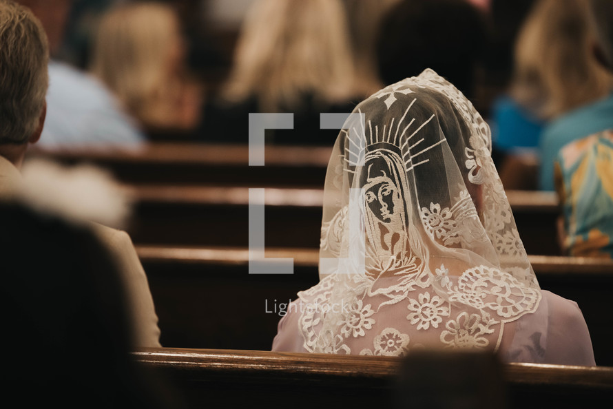 a woman wearing a veil with mother mary