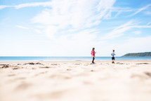 children walking on a beach 