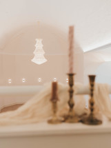 regal scene with brass candlesticks and a crystal chandelier