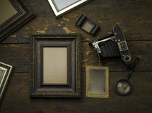 blank frame and vintage camera 