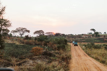 vehicles on a dirt road 