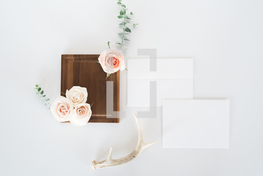 stationary, wood tray, antlers, and roses 