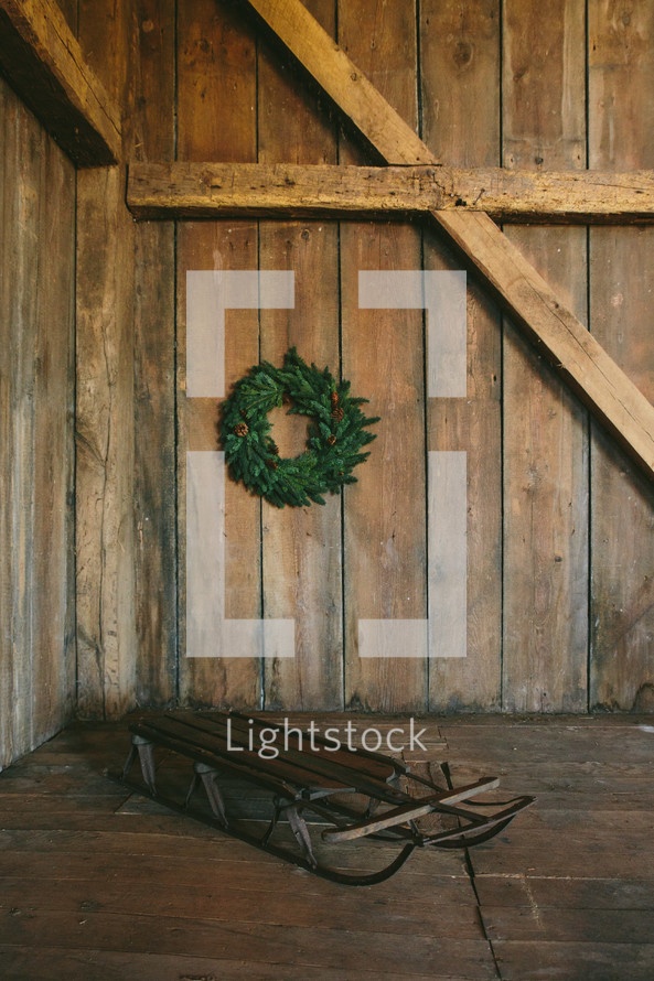 wood sled and wreath 
