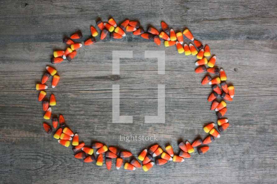candy corn frame on wood 