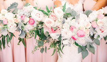bridesmaids and bride holding bouquets 