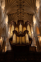 Church organ inside Norwich Cathedral, large pipe organ, beautiful religious architecture