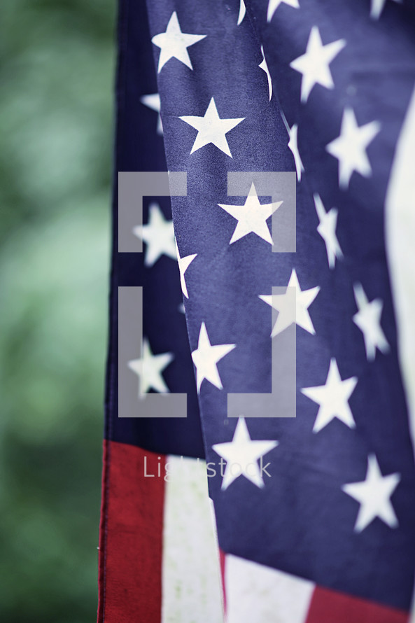 American flag on a flag pole outdoors 