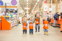 children in home depot aprons 