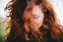 woman with red curly hair 