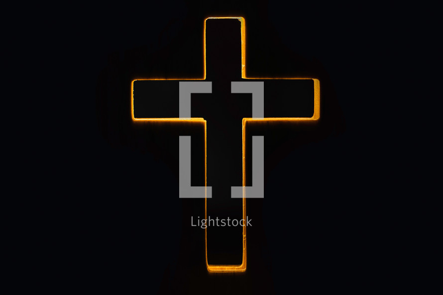 Silhouette of christian cross on black background. Copy space. 