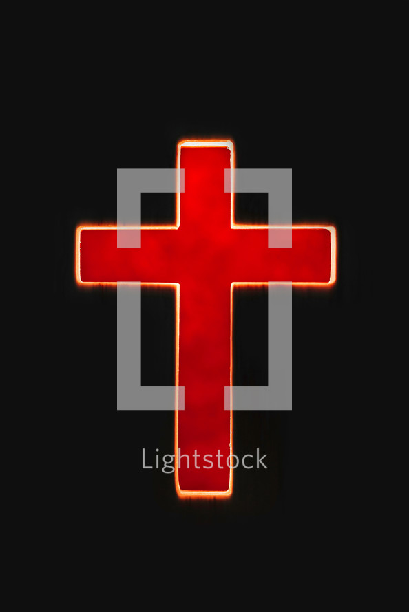 Bright cross on a black background. Copy space. 